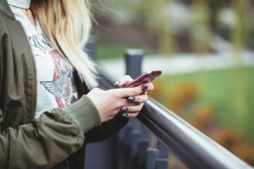image of a girl using a phone for a blog post