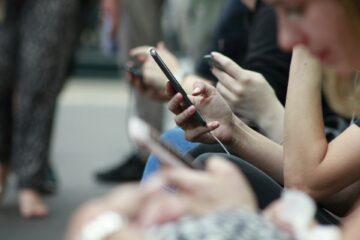 people using their phone for a report about uk mobile internet usage research